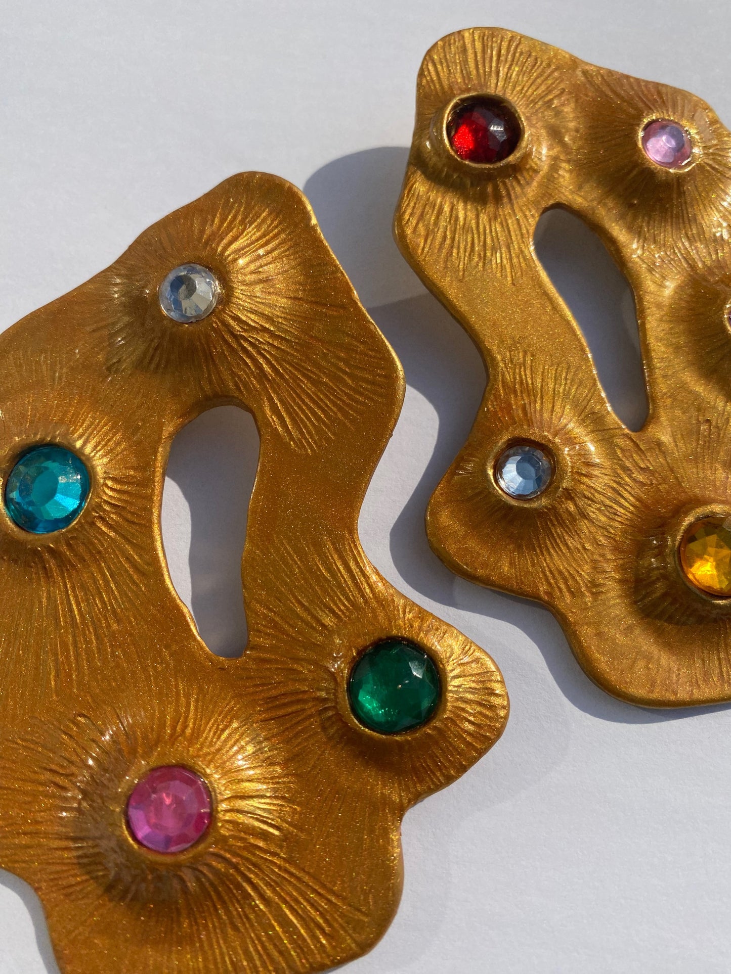 The Florence bedazzled statement earrings with gold shimmer and resin for shine